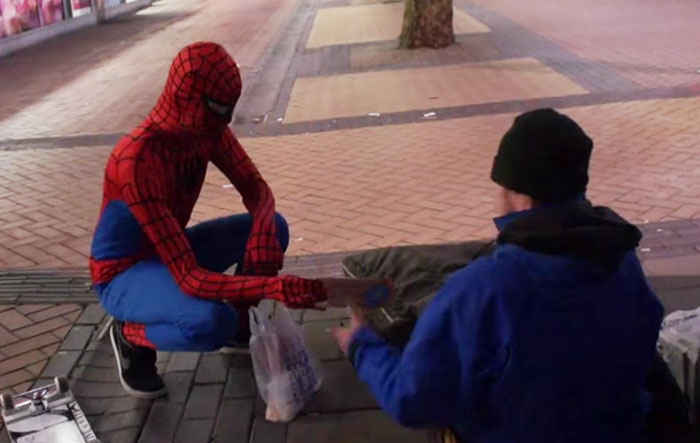 Anonymous Spiderman feed homeless at night geotv.ge