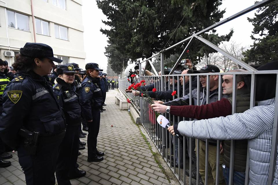 “Let’s see if you can wrestle with women”- Interior minister to the opposition opposition_handing_flowers_policewomen
